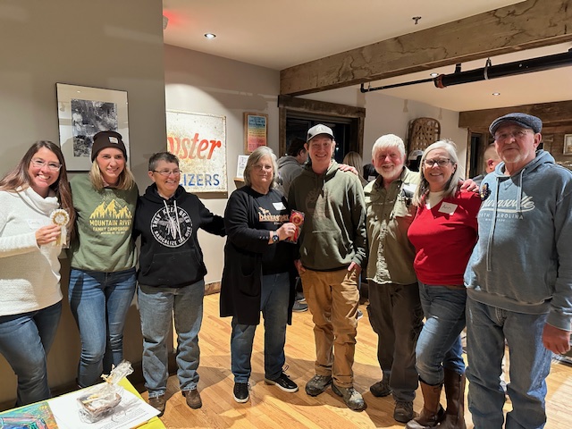 Left to right, honey contest winners: Camille Collins, Suzanne Garland (representing Kim Gunter), Susan Spruill, Peggy Watson, Yancey Jones, Ed Geouge, Ann Coomber, Jim Coomber.